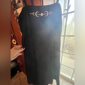 Black midsize dress with embroidery moons on it